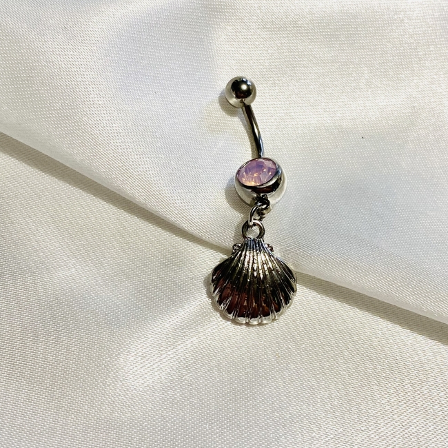 Piercing avec une coquille st Jacques