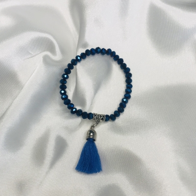 Bracelet bleu nuit en perles de verre et pompon