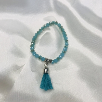 Bracelet turquoise en perles de verre et pompon