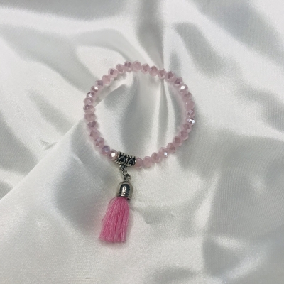 Bracelet rose en perles de verre et pompon