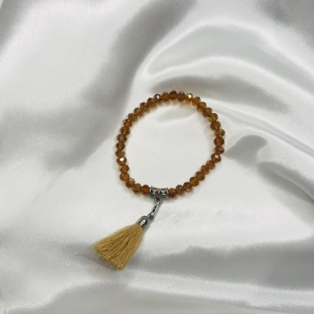 Bracelet ambre en perles de verre et pompon